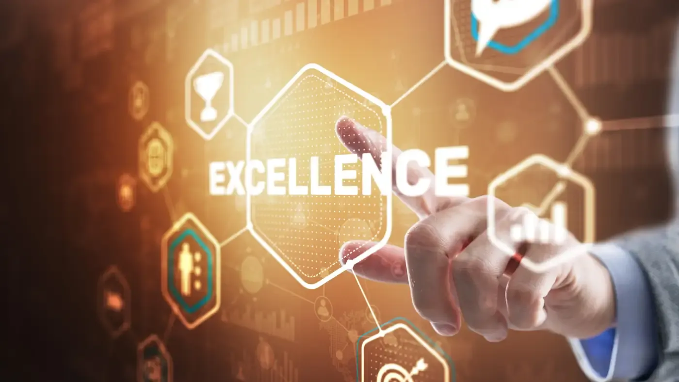 A hand reaches toward a glowing hexagon labeled "EXCELLENCE" amid digital icons and circuit patterns. The warm colors suggest innovation and aspiration.
