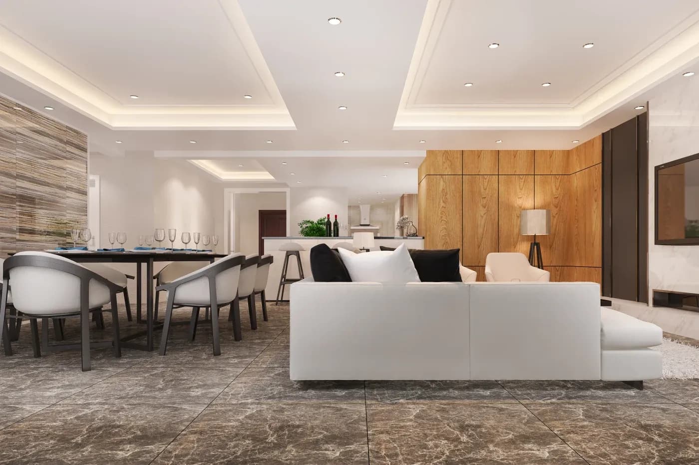 Modern open-plan living and dining area with sleek decor. Features a white sofa, marble flooring, wooden panels, and recessed lighting, conveying elegance.