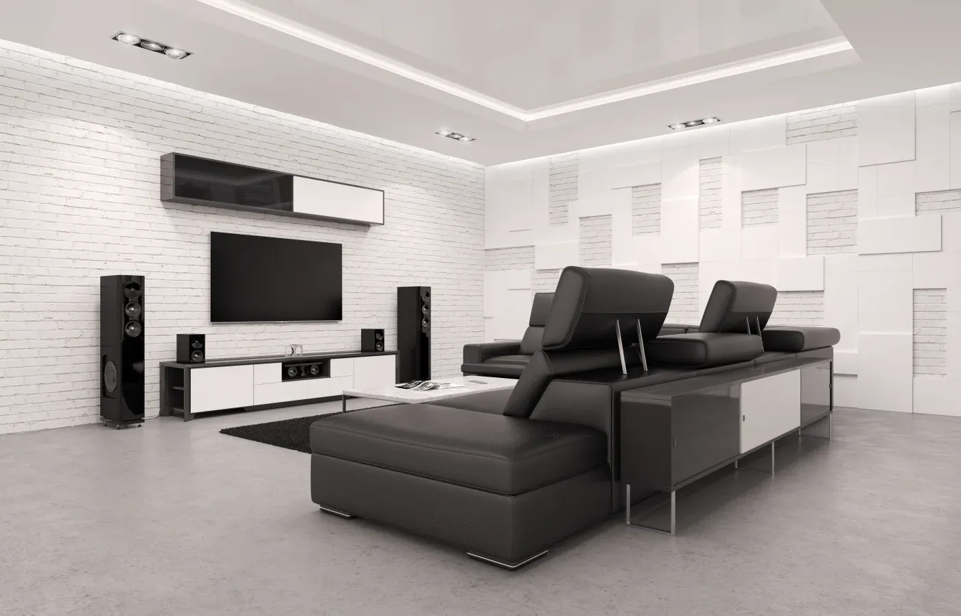 Modern living room with sleek black and white decor. A large sectional sofa faces a mounted TV, framed by stylish speakers and geometric wall panels.